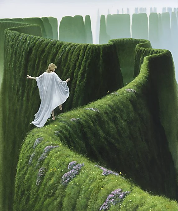 A white-robed figure following a narrow green path through a towering hedge maze